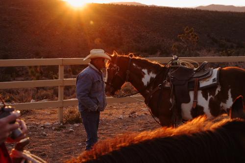 CRW_3730.JPG - Another wrangler tends his horse.  We were well cared for and watched over on the ride.