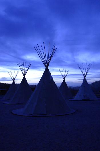 CRW_3735.JPG - Teepees at dusk.  In warmer weather, guests can stay in the teepees.  While I'm sure they would be fun for kids, they are rather basic, and they do not have an insuite bath.