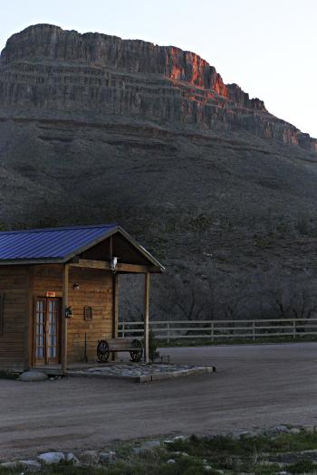 IMG_3634.JPG - Our cabin with Spirit Mountain in the background at dawn.